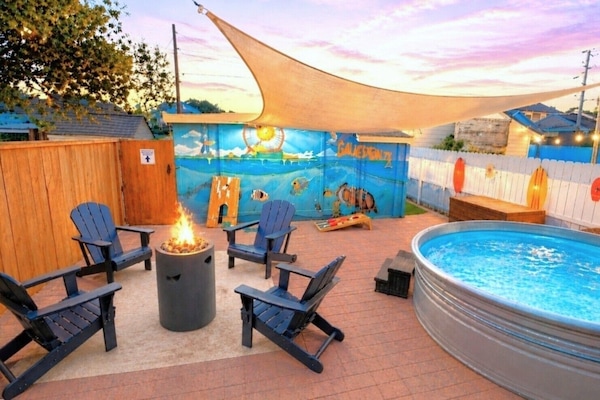 Spend the day at the beach, then unwind in the backyard beach retreat!