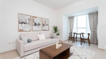 Executive Apartment, 1 Bedroom, Kitchen, Bay View | Living area | 55-inch Smart TV with satellite channels, Netflix, Hulu