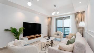 Elite Apartment, 2 Bedrooms, Beach View | Living area | 55-inch Smart TV with satellite channels, Netflix, Hulu