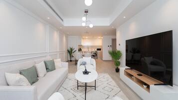 Elite Apartment, 2 Bedrooms, Beach View | Living area | 55-inch Smart TV with satellite channels, Netflix, Hulu