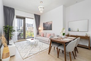 Executive Apartment, 1 Bedroom, Pool View | Living area | 55-inch Smart TV with satellite channels, Netflix, Hulu - Gala Guests - Sparkle Tower Residences (Dubai)