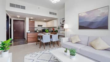 Deluxe Apartment, 1 Bedroom, Sea View | Living room | 55-inch Smart TV with satellite channels, Netflix, Hulu