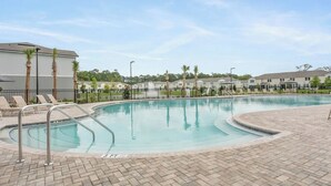 A swimming pool with a 3 ft depth marker, surrounded by lounge chairs and palm trees. - New St. Augustine Getaway Near Beaches, Golf & Downtown Adventures (St. Augustine)