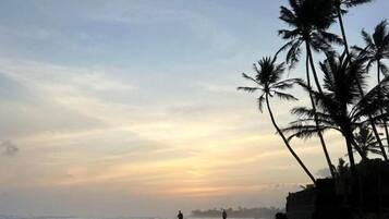 On the beach, white sand, sun-loungers, beach umbrellas