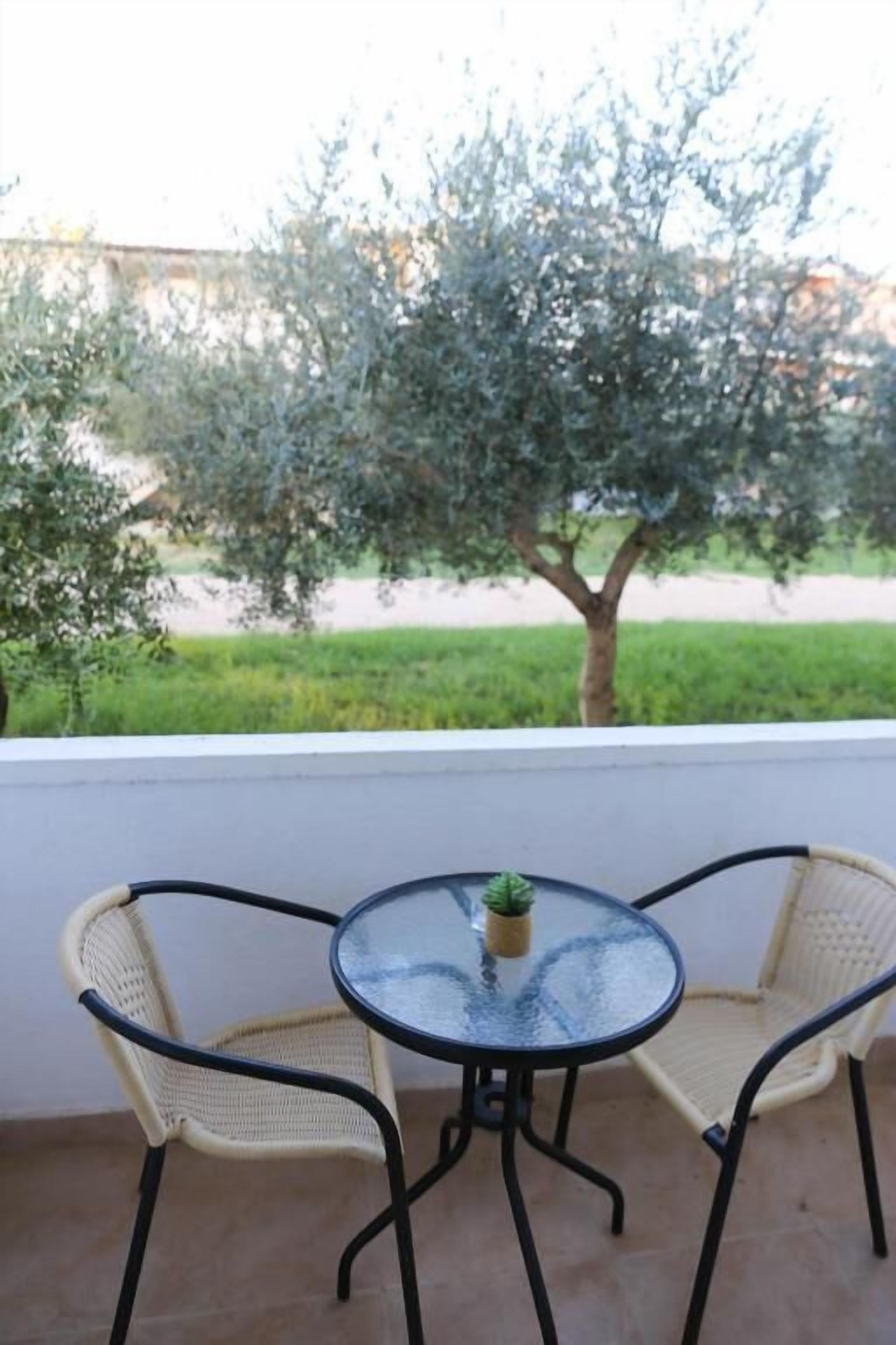 Basic Triple Room, Balcony, Garden View | Outdoor dining