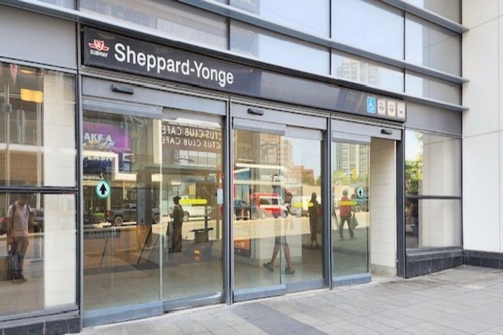 A Sheppard-Yonge Subway entrance with glass doors and a clear view of the street outside.