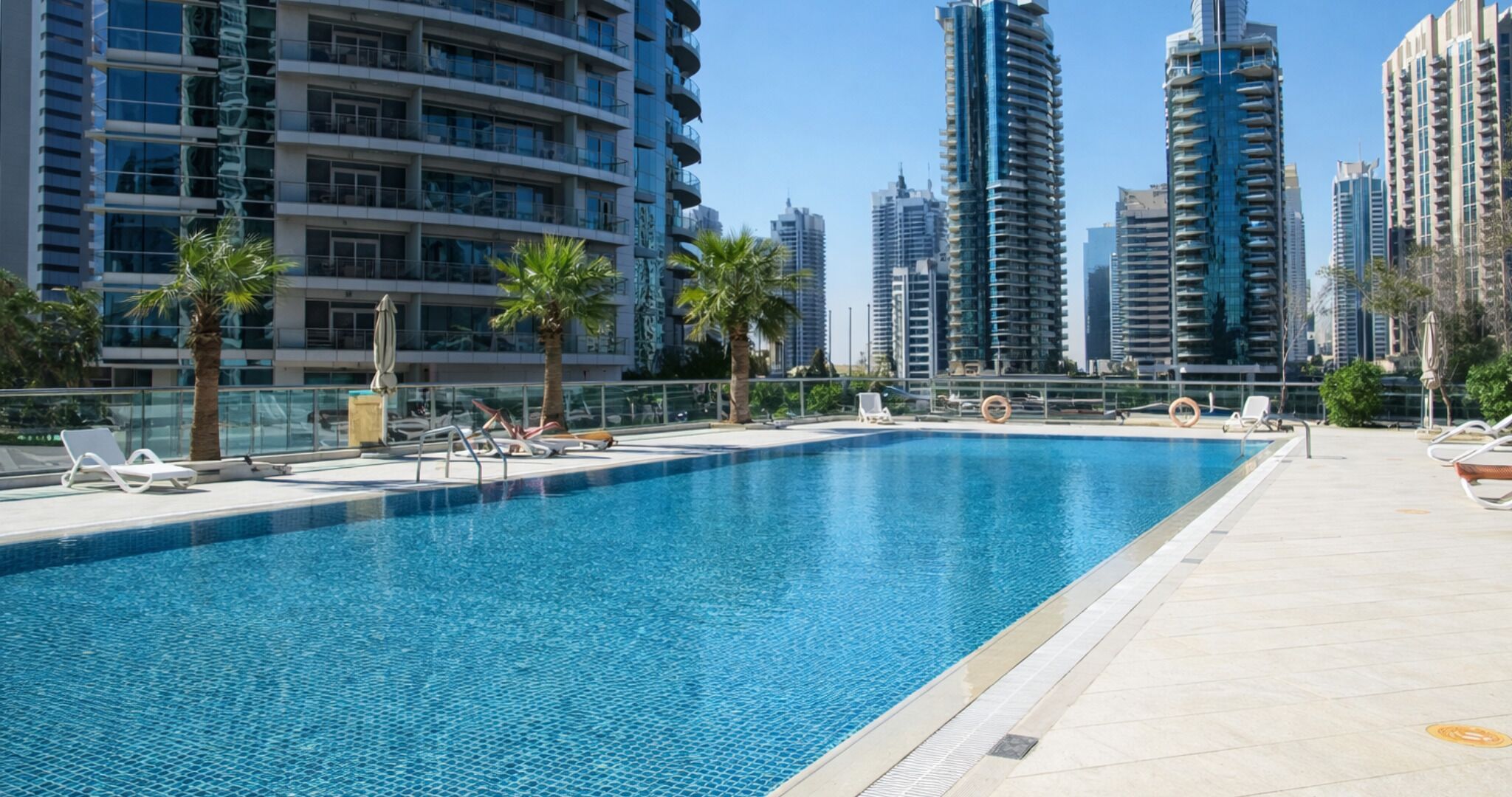 2 outdoor pools, open 8:00 AM to 10:00 PM, pool umbrellas, pool loungers