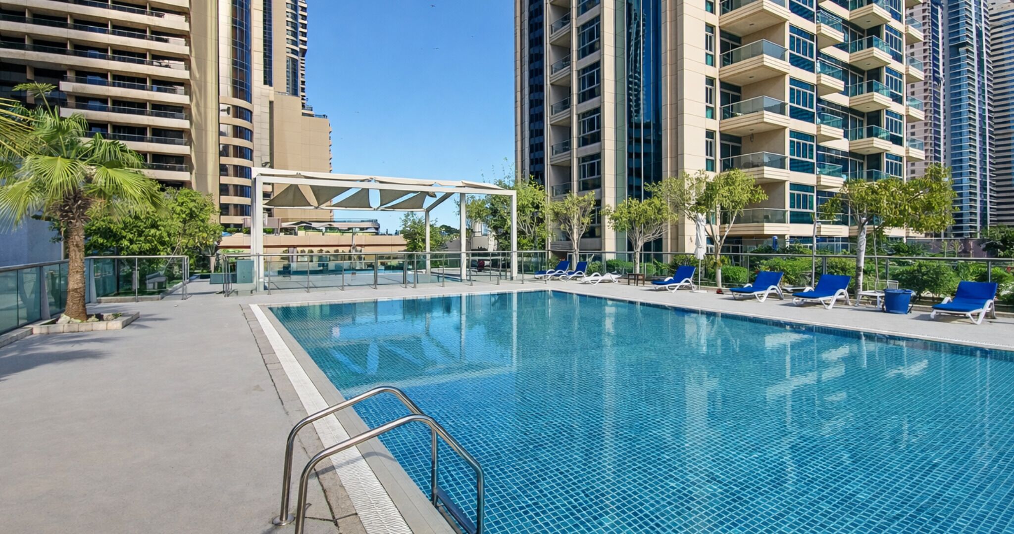 2 outdoor pools, open 8:00 AM to 10:00 PM, pool umbrellas, pool loungers