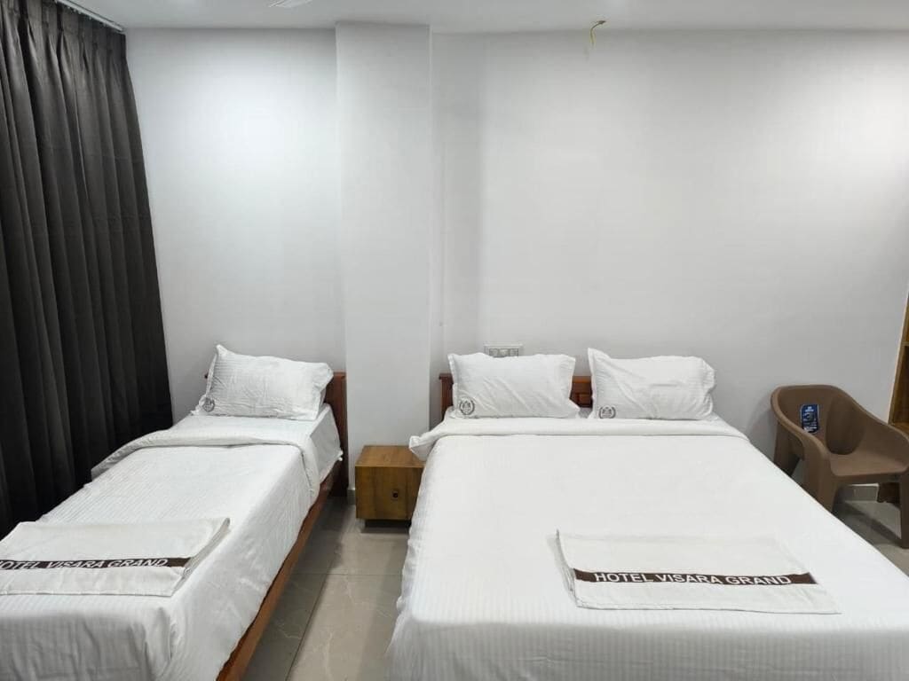 Deluxe Triple Room, City View | Desk, laptop workspace, blackout curtains, soundproofing