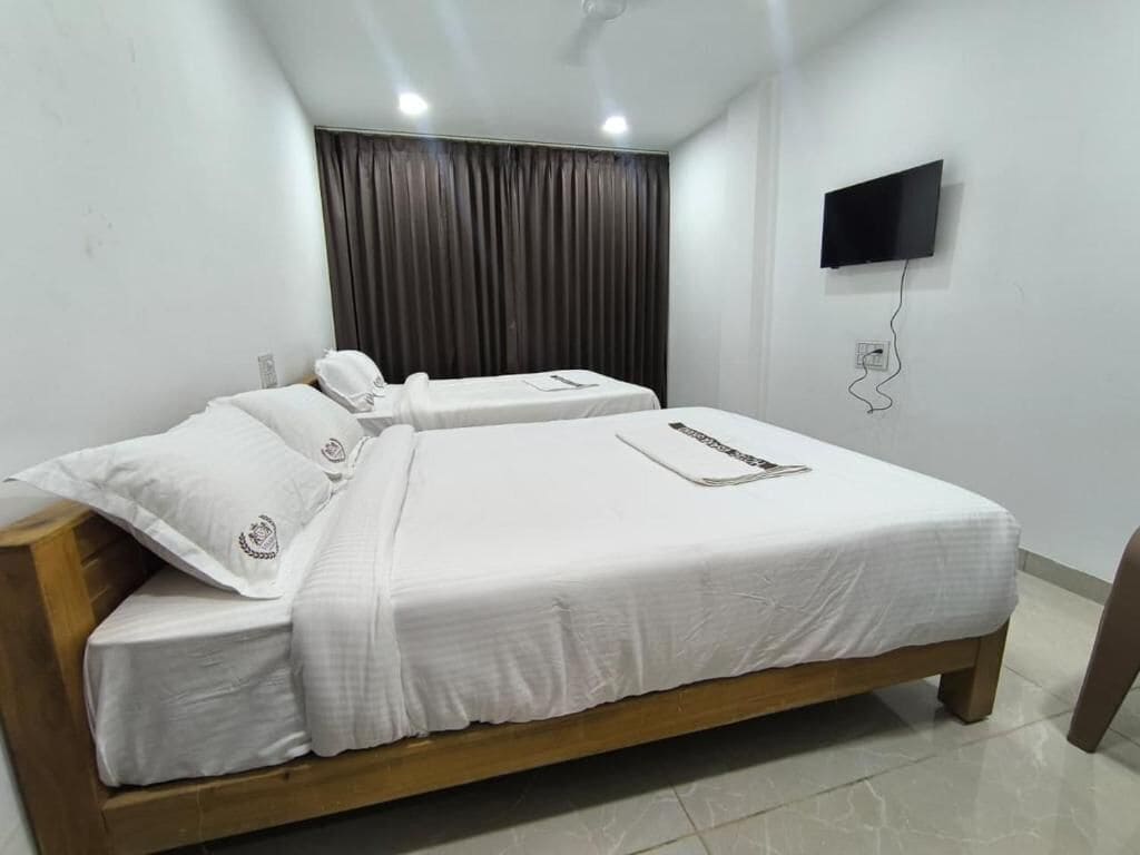 Classic Quadruple Room, City View | Desk, laptop workspace, blackout curtains, soundproofing