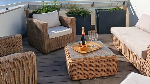 A rooftop terrace with wicker furniture, a bottle of champagne, and glasses on a tray. - SUPERB T4 SEAFRONT WITH ROOFTOP IN ST JEAN DE MONTS (Saint-Jean-de-Monts)