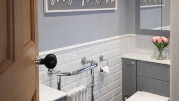 Combined shower/bathtub, deep-soaking bathtub, hair dryer, towels