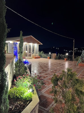 A house with a patio, a pool, and a view of the mountains. - Secluded Hilltop Villa Near Ancient Jarash — Privacy, Views & Pure Tranquility (Jerash)