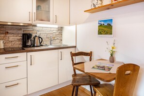 Fridge, stovetop, coffee/tea maker, electric kettle