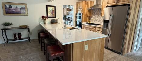 Coffee/tea maker, fridge, microwave, oven