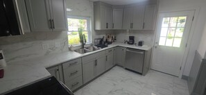 Fridge, microwave, oven, stovetop - Modern 5BR Live Oak Haven – Minutes from Suwannee Music Park & Springs! (Live Oak)