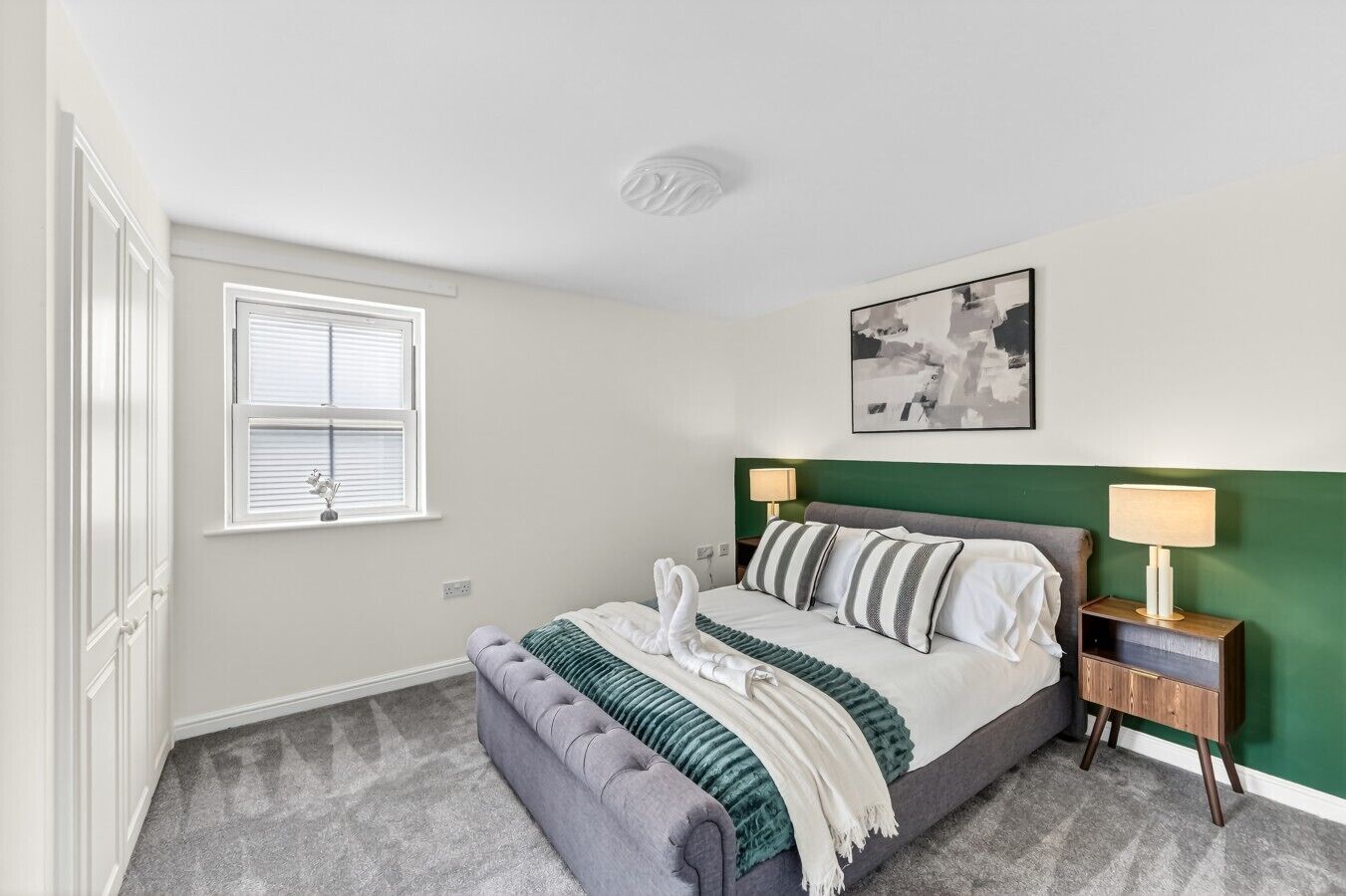 Bedroom 1 features a private ensuite bathroom and a comfortable double bed, complete with fresh linen and complimentary towels for your stay.