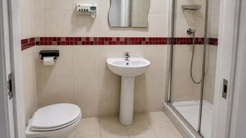 Shower, towels, soap, toilet paper