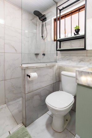 Bidet, towels, soap, toilet paper