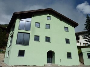 A multi-story building with a flat roof, several windows, and a visible entrance. - Haus Anemone, (Samnaun-Laret) by Interhome (Samnaun)