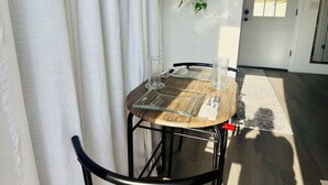 A dining table with chairs, a glass, a napkin, and a menu. -  Functional and newly renovated in-law suite with private entrance and yard (Sanford)