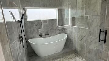 Shower, hair dryer, towels, toilet paper