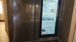 A stainless steel refrigerator with a built-in ice maker and freezer compartment. - Spacious 2BR 2BA Near FSU, FAMU & Downtown (Tallahassee)