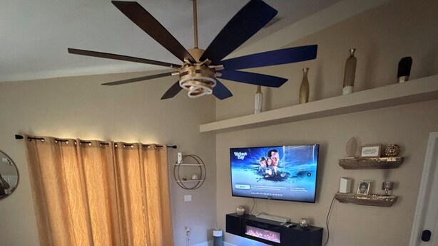 A living room with a ceiling fan, a flat-screen TV, a sofa, a coffee table, and a fireplace. - Spacious 2BR 2BA Near FSU, FAMU & Downtown (Tallahassee)