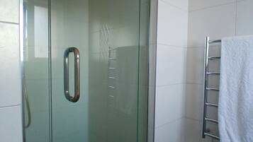 Shower, hair dryer, towels, toilet paper