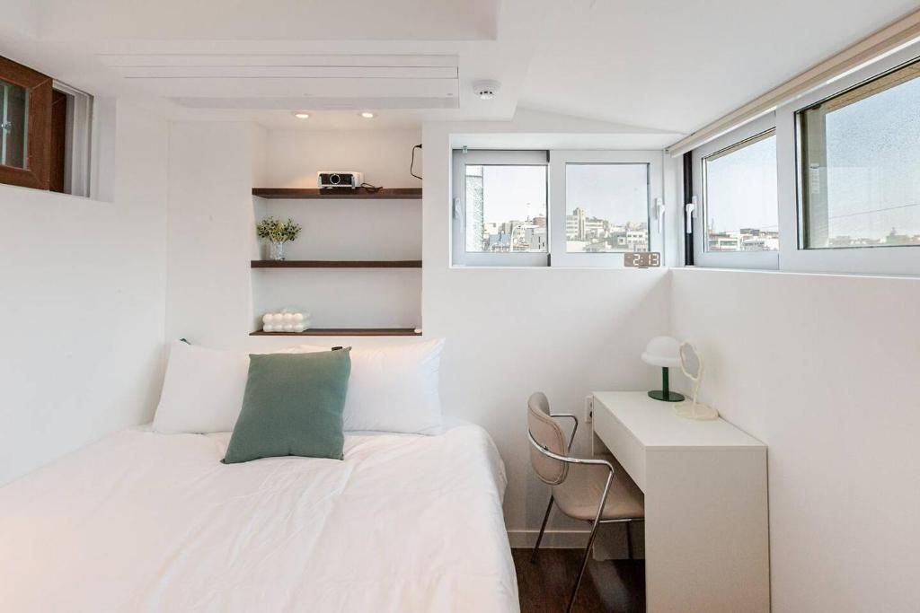 Desk, laptop workspace, blackout curtains, iron/ironing board