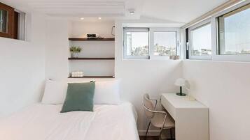 Desk, laptop workspace, blackout curtains, iron/ironing board