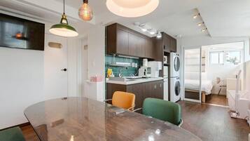 Desk, laptop workspace, blackout curtains, iron/ironing board
