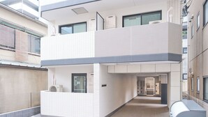A modern building with a two-story structure, a reception area, and a visible entrance. - Sees Kinshicho II (Tokyo)