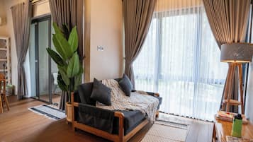 Desk, iron/ironing board, bed sheets