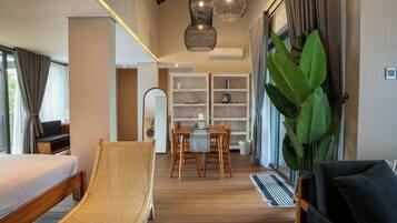 Desk, iron/ironing board, bed sheets