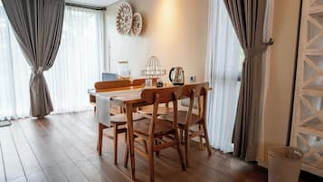 Desk, iron/ironing board, bed sheets