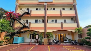 A multi-story building with a sign reading 'PALM WOODS PENSIONA HOMES.' - Palm Woods Pensionne Home General Santos (General Santos)