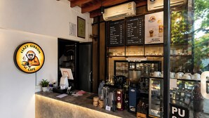 A cafe with a counter, menu boards, and a 'PUSH' sign. - Lazy Gibbon 2 Chiang Mai - Haiya (Chiang Mai)