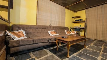 Family House, Balcony, Garden View | Living area | 24-inch Smart TV with digital channels