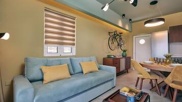 Deluxe Apartment, Garden View | Living area | 32-inch Smart TV with cable channels, Netflix, streaming services