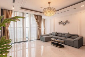 Deluxe Apartment, 4 Bedrooms, City View | Living area | 75-inch flat-screen TV with digital channels - The Kingston Landmark 81 Sky Residence (Thanh My Tay)