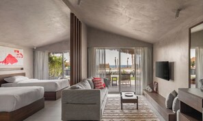Habitación Deluxe con 1 cama matrimonial o 2 individuales, vista a la playa | Área de sala de estar