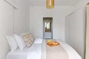 1 bedroom, desk, iron/ironing board, travel crib