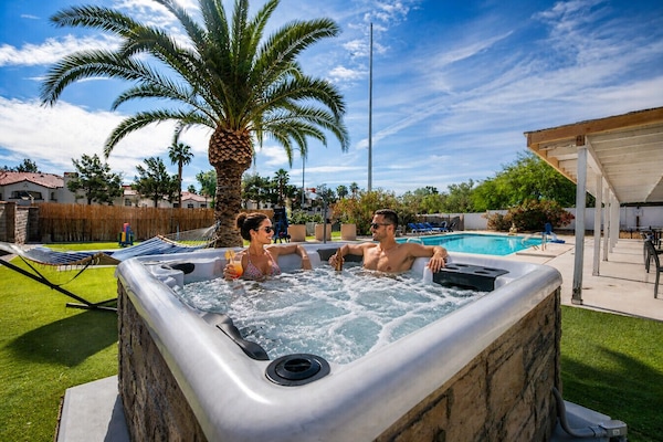 Soak under the stars in the bubbling hot tub and enjoy a perfect evening moment together after a full day of Vegas fun.