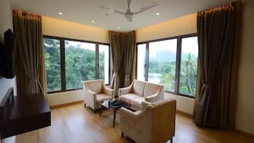 Premium Suite, River View | Living area | 1-inch LED TV with satellite channels