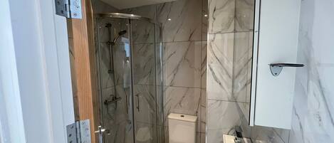 Shower, hair dryer, towels, soap
