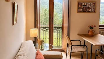 Deluxe Apartment, 1 Bedroom | Living area | TV