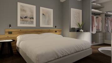 Un dormitorio moderno con una cama grande, cabecera de madera, una mesita de noche y un mueble auxiliar. Hay dos cuadros abstractos enmarcados en la pared, un espejo y un armario con ropa colgada.