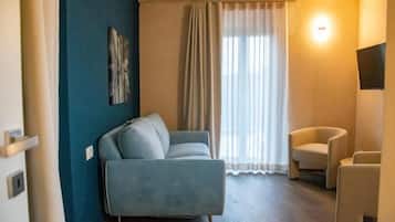 Junior Double Room | Living area | 41-inch Smart TV with cable channels