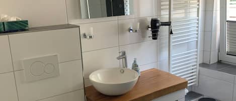Shower, hair dryer, towels, toilet paper